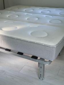 a mattress sitting on top of a bed frame at Chalet de la Source in Casanova