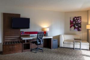 a hotel room with a desk and a chair at Delta Hotels by Marriott Montreal in Montreal