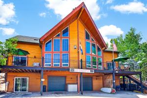 a large house with a balcony on top of it at 1BR Mountain View Studio with Fireplace Deck Views in Fort Collins