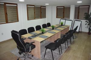 a large conference room with a long table and chairs at Komitski Konak & Spa in Plešanci