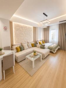 a living room with a couch and a table at Petreski Apartments 1 in Ohrid