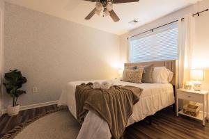 a bedroom with a bed with a ceiling fan at Spacious 3 Bed Condo Near ETSU in Johnson City