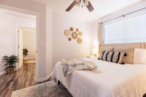 a bedroom with a bed and a ceiling fan at Spacious 3 Bed Condo Near ETSU in Johnson City +40 photos