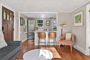 a living room with a couch and a table at The McKinley Cottage in Boise
