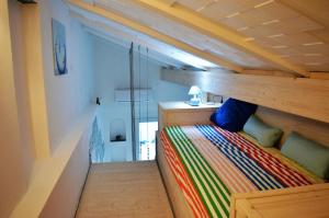 Tempat tidur dalam kamar di House Maestrale by Holiday World