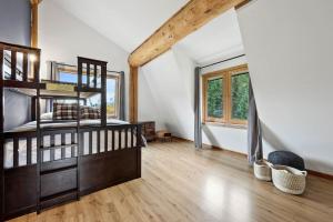 a bedroom with a bunk bed and a large window at Cabin on Private 8-acre Lake in Clearwater