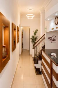a hallway in a building with a staircase at Deville Inn in Lima