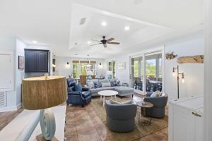 a living room with a couch and a table at St George Island Bay Front Pool in St. George Island