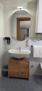 a bathroom with a sink and a mirror at Suite 58 rooms in Giulianova +26 photos