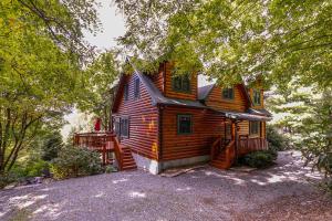 a wooden house with a porch and a deck at Windswept Vistas in Boone +46 photos
