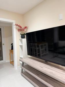 a large flat screen tv in a living room at Sunset Beach Paradise Home in Sunset Beach