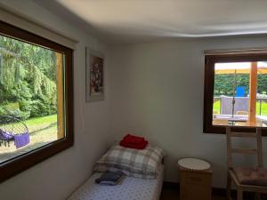 a small bedroom with a bed and a window at Lawendowa Weranda in Krasnobród