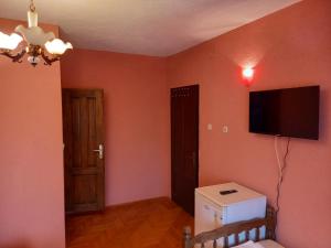 a room with a flat screen tv on a wall at Villa Marija in Struga