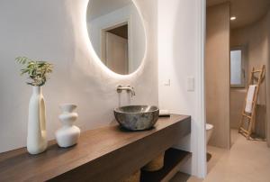 a bathroom with a bowl sink and a mirror at Villa AELIA by LLB Mykonos - 2BDR - Sea & Sunset view in Mikonos