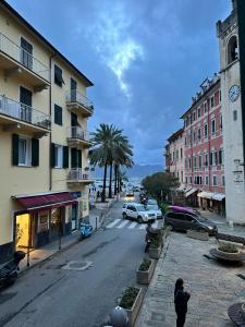 a city street with buildings and a clock tower at Petriccioli seaview in Lerici