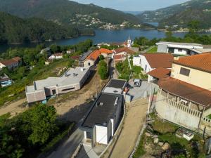 an aerial view of a town with a lake at Terreiro da Serra in Rio Caldo