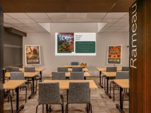 an empty classroom with tables and chairs at ibis Paris Bastille Opera in Paris