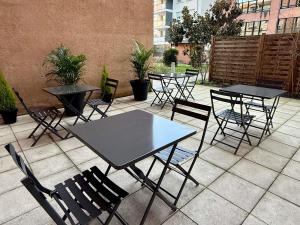 a group of tables and chairs on a patio at ibis Toulouse Pont Jumeaux in Toulouse