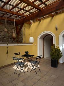 a patio with a table and chairs and a building at Prázdninový dům Litomyšl 79 in Litomyšl
