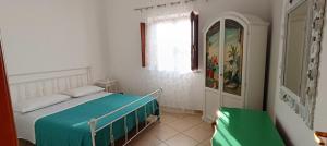 Lova arba lovos apgyvendinimo įstaigoje La casa in campagna