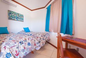 Łóżko lub łóżka w pokoju w obiekcie Hotel Los Corales