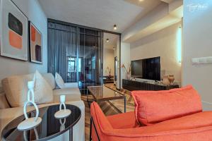 a living room with a couch and a table at La Cepa Apartamentos in Alhama de Granada
