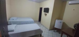 MK HOTEL Juruti 객실 침대 사진 7개 이상