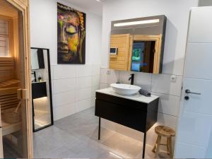 a bathroom with a sink and a mirror at Apartment Jonte im Dangaster Nest in Varel