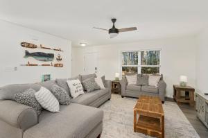 a living room with a couch and a table at Hidden Gem in Greenbackville