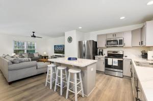 an open kitchen and living room with a couch at Hidden Gem in Greenbackville +40 photos