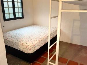 a bedroom with a bunk bed and a bunk bedouble at Cabaña destino 11 in Mérida +2 photos