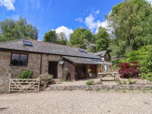 an old stone cottage with a barn at Pottery Barn in Branscombe
