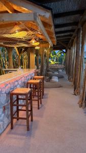 a row of tables and stools in a bar at Nafplio Lodge in Nafplio