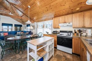 a kitchen and dining room with a table and chairs at Les Bon Temps in Birch Town