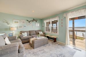 a living room with a couch and a table at Lighthouse Pointe in Birch Town