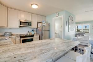 a kitchen with a large marble counter top at Lighthouse Pointe in Birch Town
