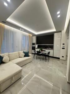 a living room with a couch and a table at Maison Miry in Rapallo