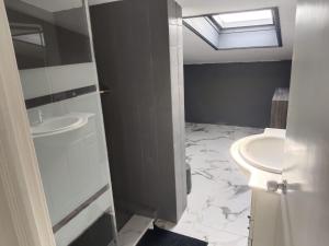 a bathroom with a sink and a toilet at Casa Copacabana in Oya +4 photos