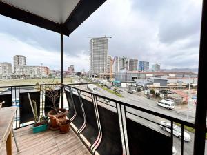 a balcony with a view of a city at Luma home in Angisa
