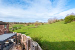 a view of a field from the deck of a house at Carleton Mill Cottage in Carlisle