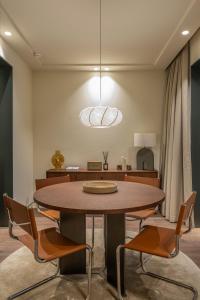 a dining room with a table and chairs at POSTCODE Chueca in Madrid