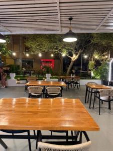 a group of tables and chairs in a restaurant at The Eden Hotel in Sarandë
