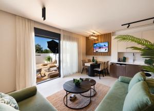 a living room with a couch and a table at Contessa Suites in Lefkada