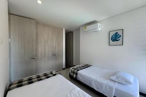 a bedroom with two beds in a room at Ocean Club by Colproperty Management in Playa Bello Horizonte +44 photos