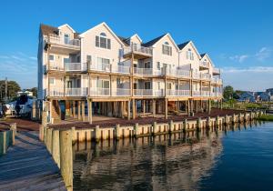 a large building on a dock next to the water at Paradise in Chincoteague