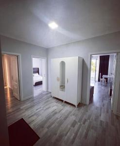 an empty room with a room with a bed and a door at Astara Villa Kiraye in Astara +15 photos