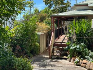 a stairway leading to a house with a gate at Treetops Escape Albury in Albury