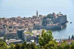 a town on the shore of a body of water at Studios Kalina in Budva