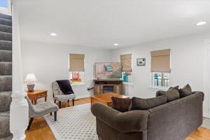 a living room with a couch and a table at Precious Time in Chincoteague