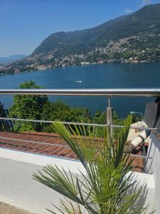 a view of the water from the balcony of a house at Vista Lago Como con terrazza in Blevio